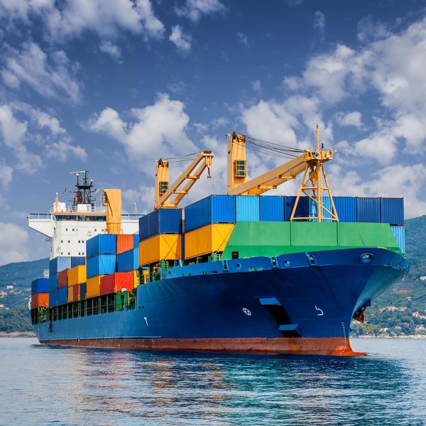 Ship with large amount of coloured shipping containers