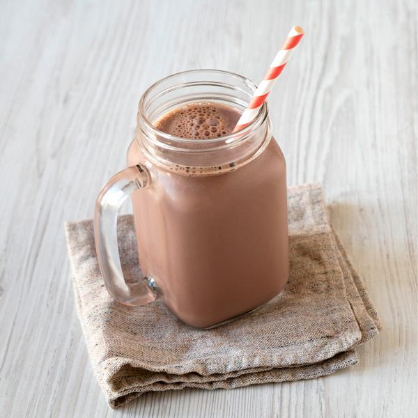 image of a glass of flavoured oat milk