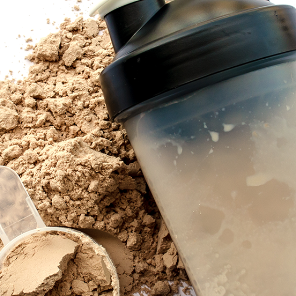 shaker and scoop of whey isolate powder