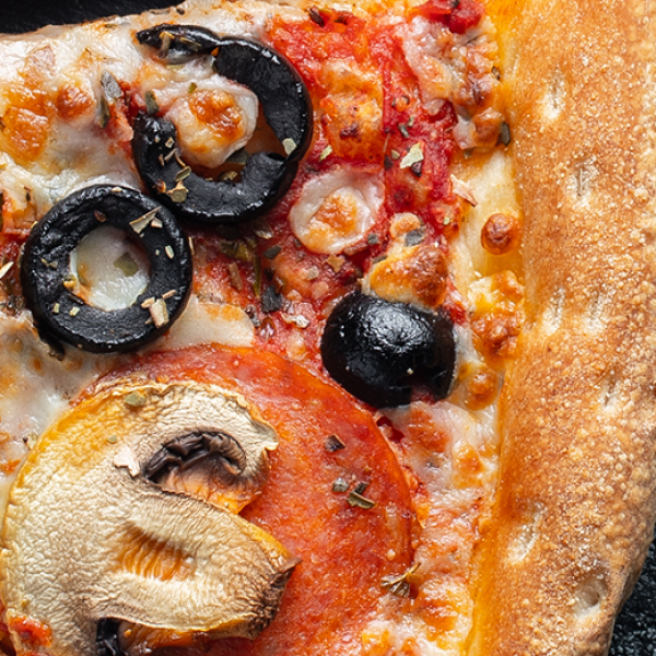 slices of pizza on grey marble table