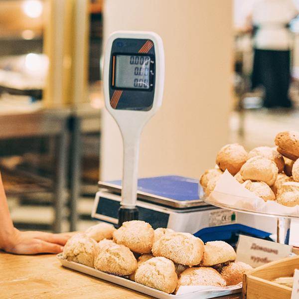 baker standing with breads