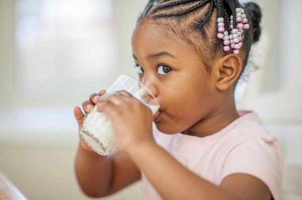 Image of child drinking a glass of milk