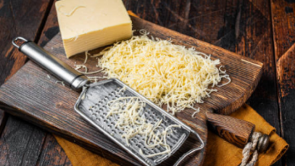 grated cheese on board
