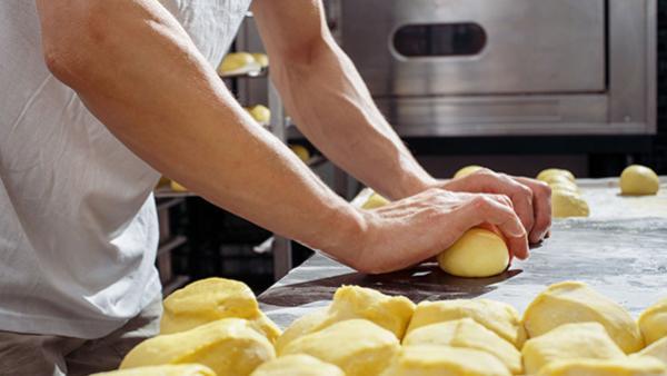 man making brioche rolls