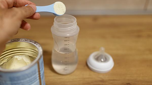 baby formula and baby bottle with water