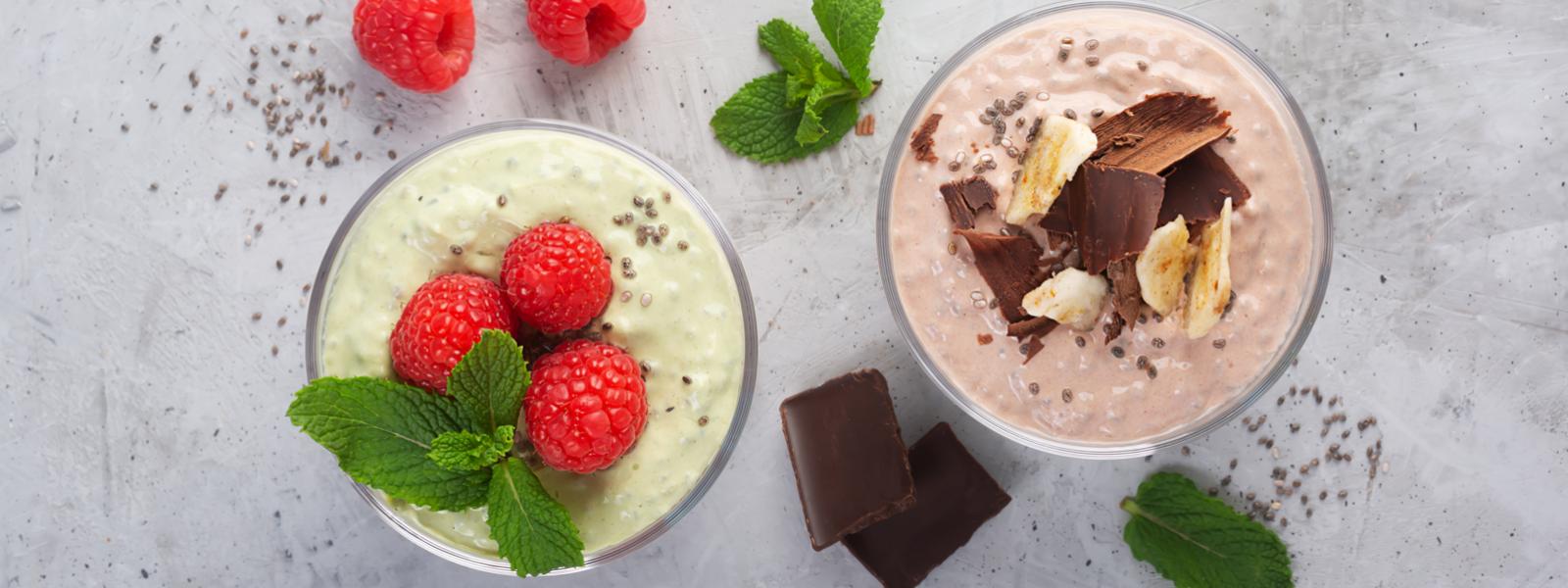 Two fresh dairy desserts in glasses from a top down angle