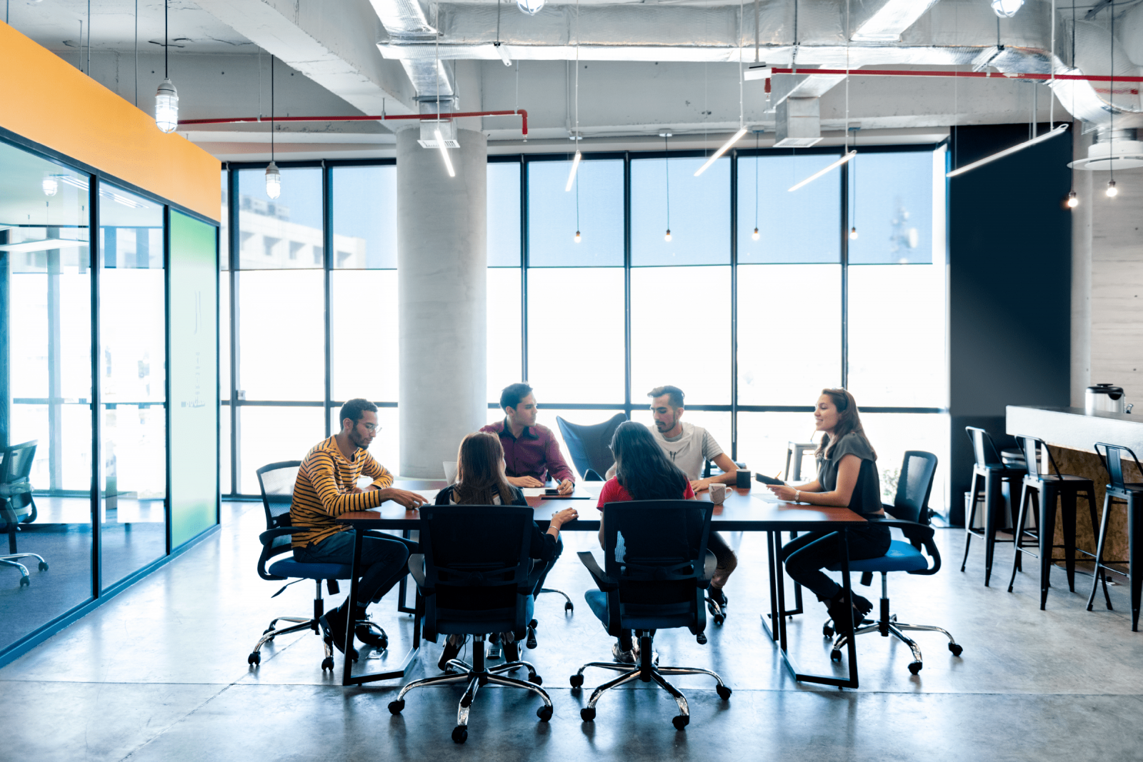 image of people sitting in an office setting collaborating