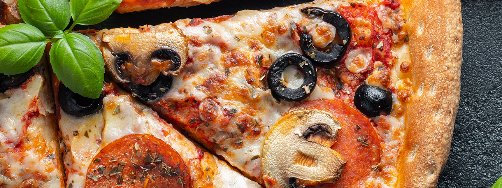 slices of pizza on grey marble table